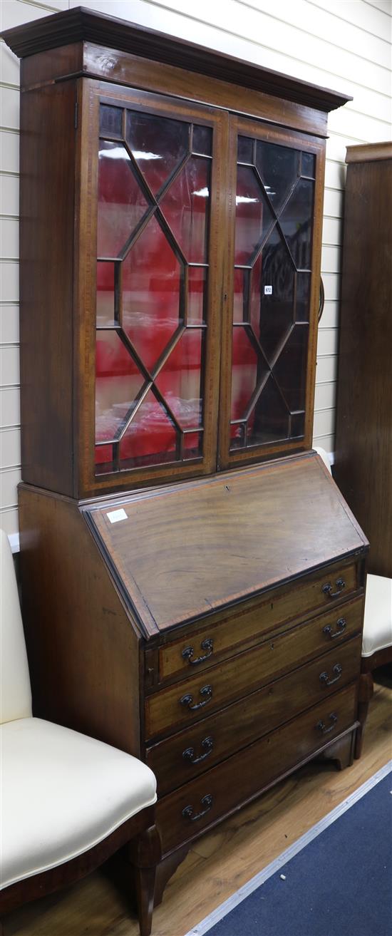 A Sheraton revival inlaid mahogany bureau bookcase W.99cm
